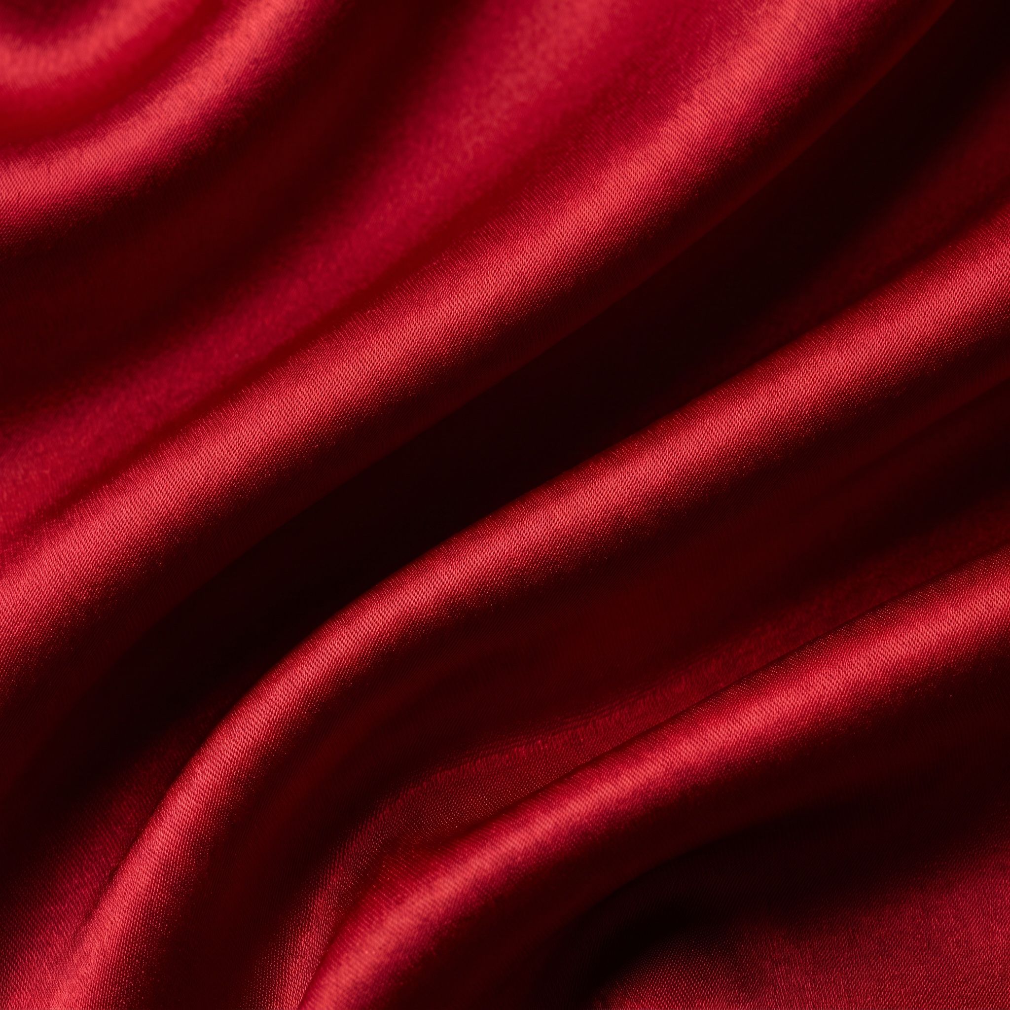 Deep red silk folds in close detail